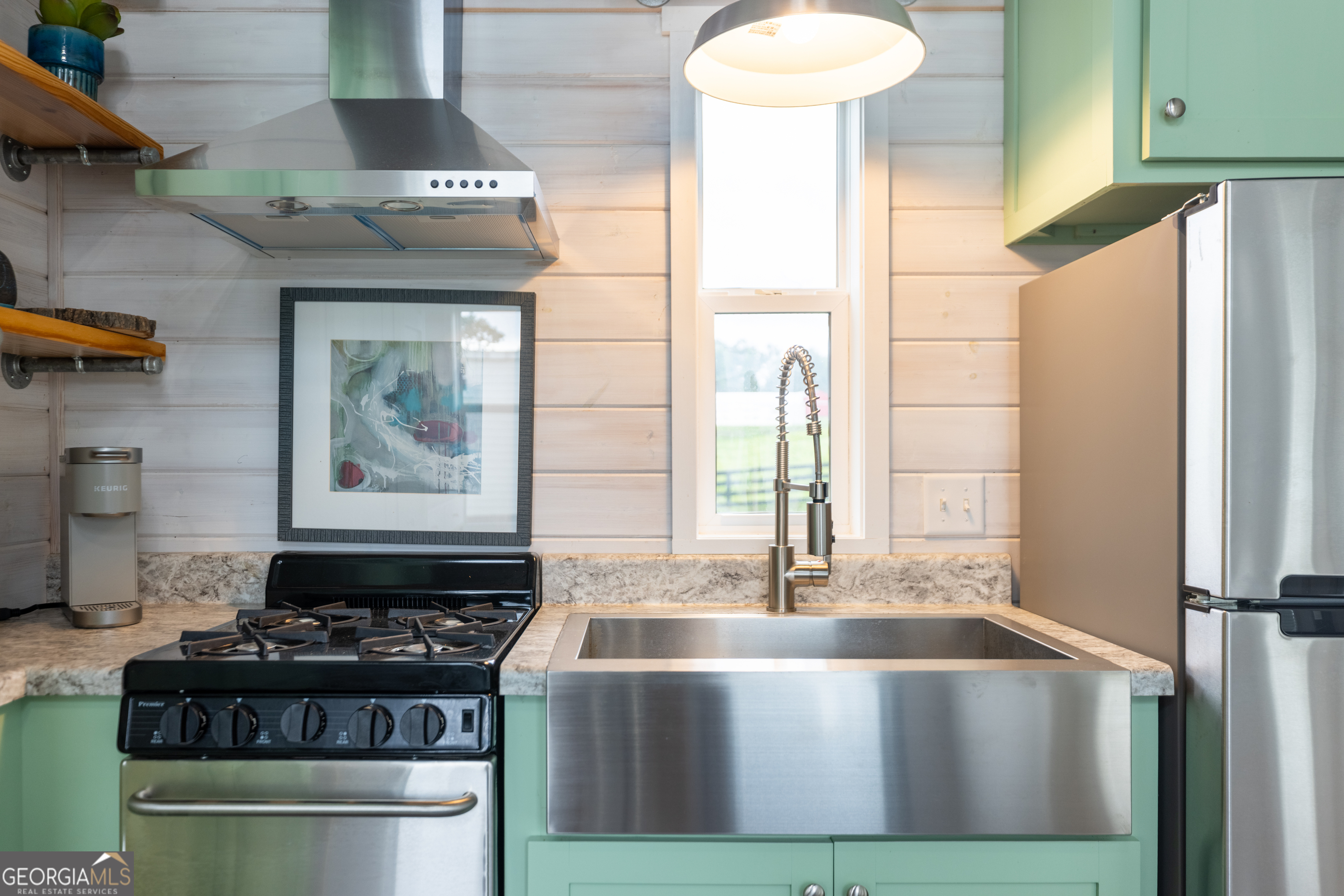 2199 Roosterville Road Roopville, GA 30170 - Photo 50 of 129 a kitchen with stainless steel appliances granite countertop a stove and a refrigerator