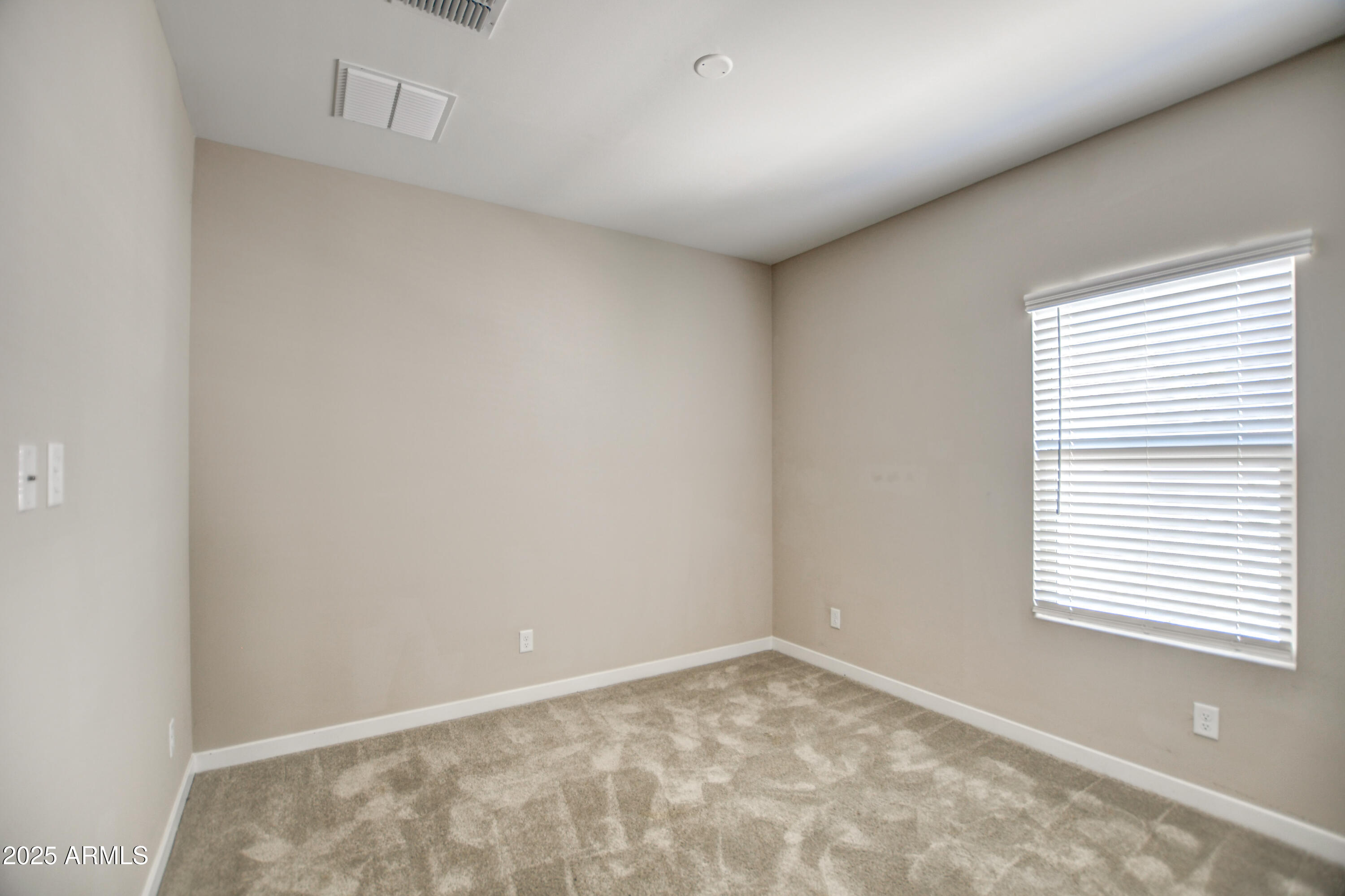 2241 West Griswold Road Phoenix, AZ 85021 - Photo 14 of 23 a view of an empty room with a window