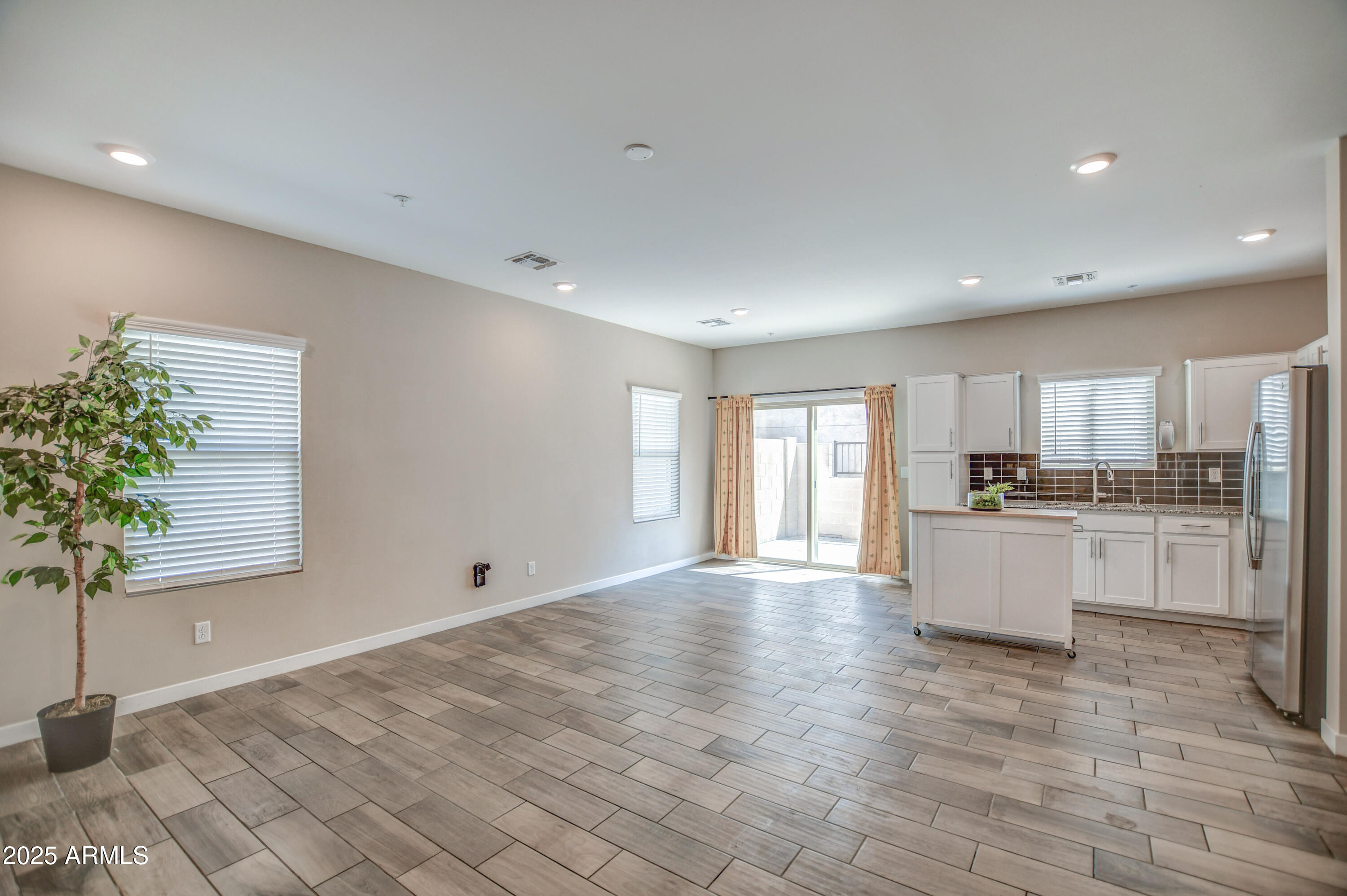 2241 West Griswold Road Phoenix, AZ 85021 - Photo 4 of 23 a open kitchen with white cabinets and white appliances