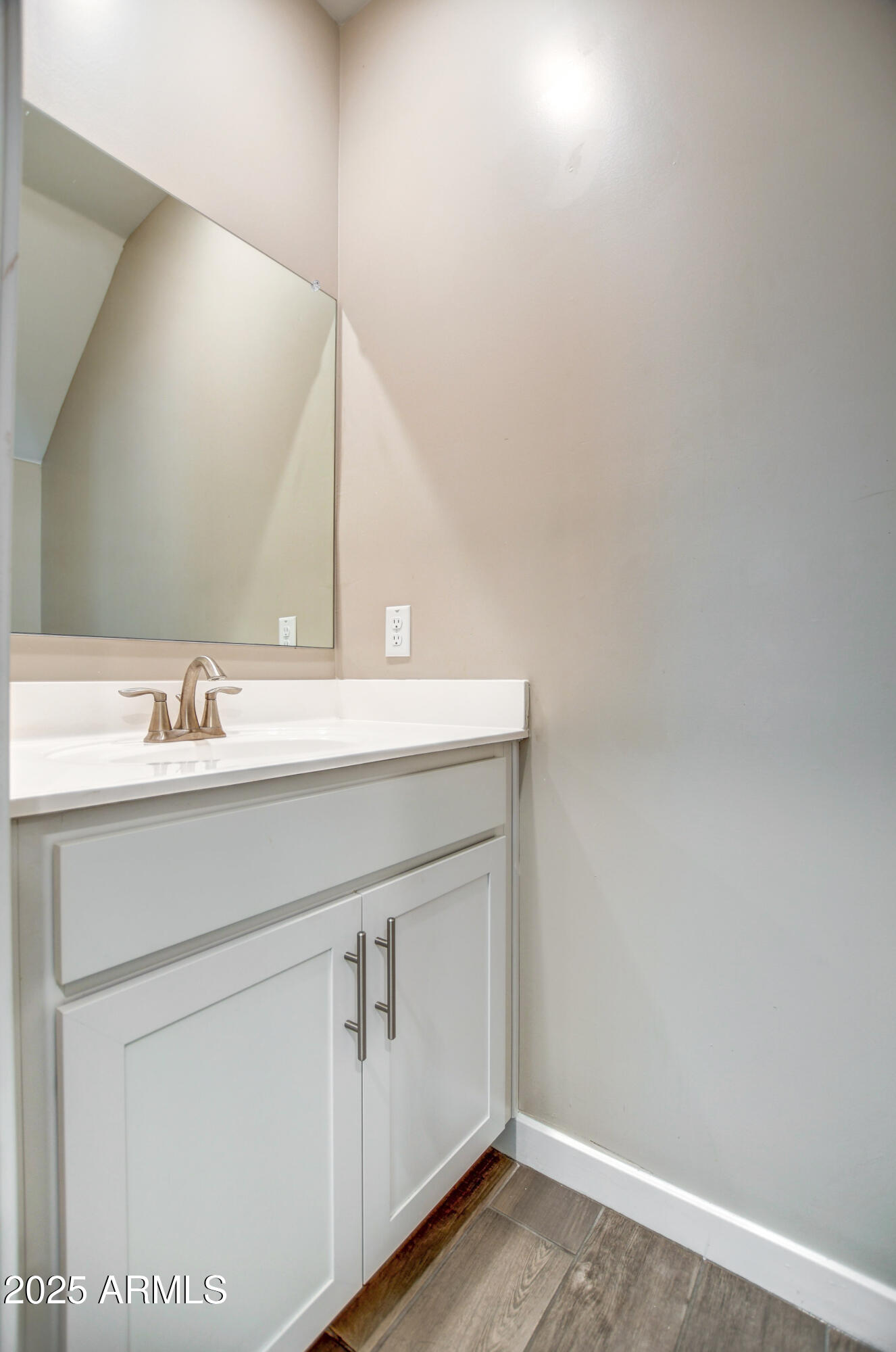 2241 West Griswold Road Phoenix, AZ 85021 - Photo 9 of 23 a bathroom with a sink and a mirror