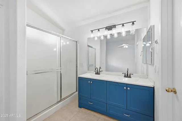 a bathroom with a double vanity sink mirror and double