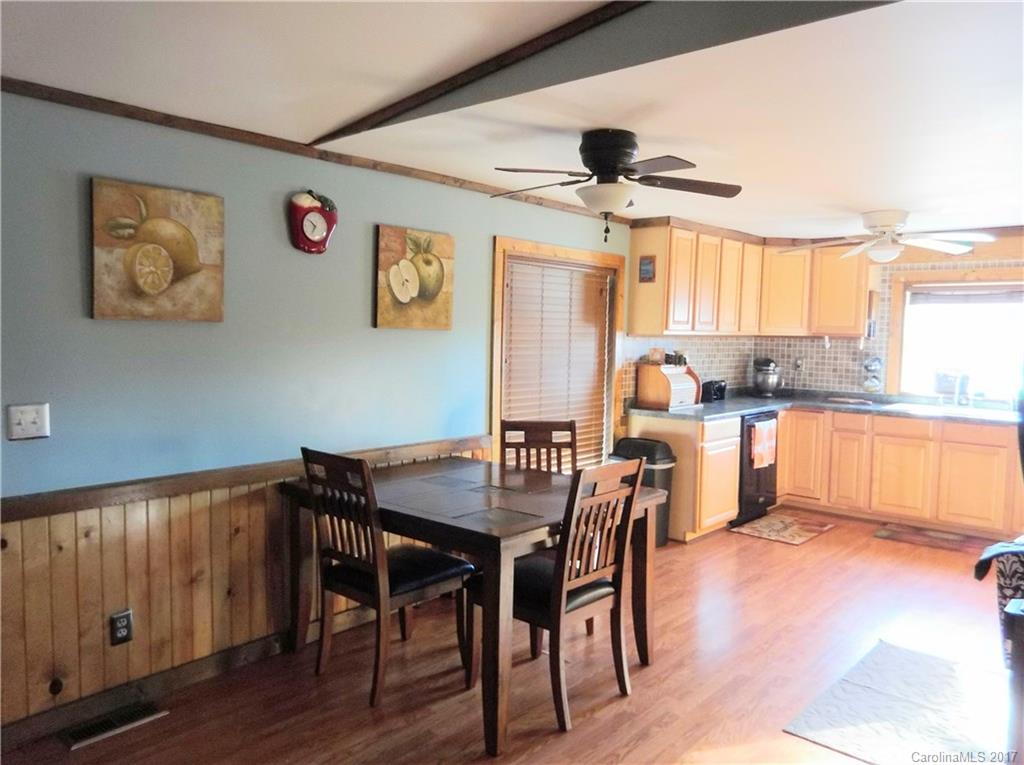 6925 Shelf Road Marshville, NC 28103 - Photo 14 of 24 a view of a dining room with furniture and a large window