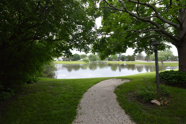 244 Inverrary Lane Deerfield, IL 60015 - Photo 13 of 17 a view of a lake with a garden