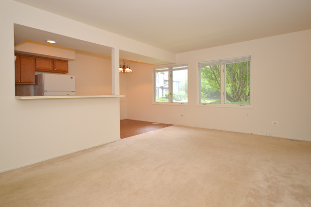 244 Inverrary Lane Deerfield, IL 60015 - Photo 3 of 17 wooden floor in an empty room with a window