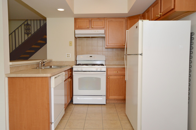 244 Inverrary Lane Deerfield, IL 60015 - Photo 5 of 17 a utility room with cabinets washer and dryer