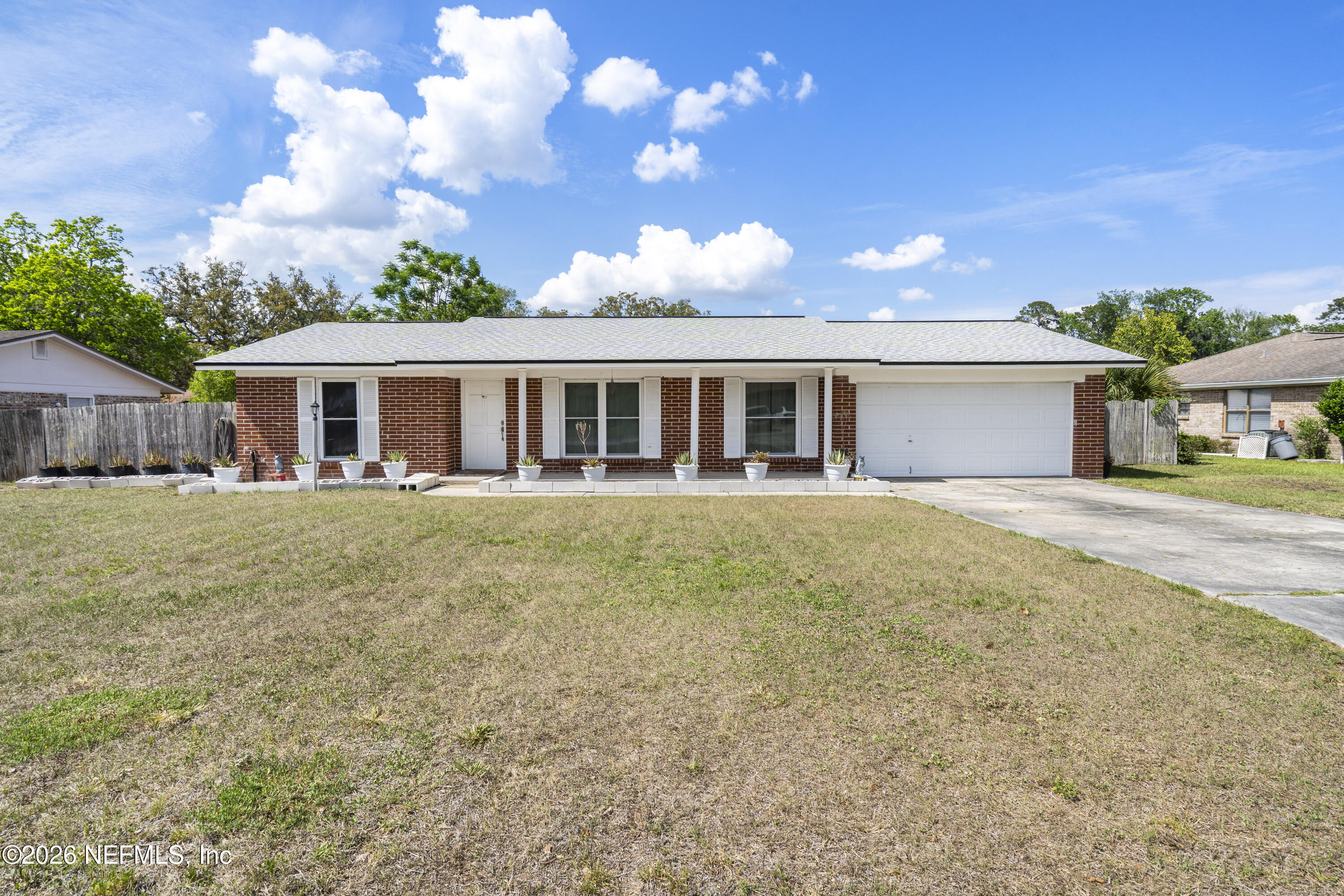 5479 Weaver Road Orange Park, FL 32073 - Photo 2 of 3 a view of a house with a swimming pool