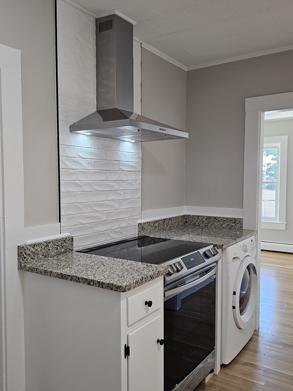 23 Ingalls Terrace, Unit 2 Swampscott, MA 01907 - Photo 2 of 24 a stove top oven sitting inside of a kitchen