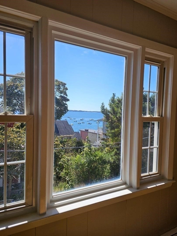 23 Ingalls Terrace, Unit 2 Swampscott, MA 01907 - Photo 7 of 24 a view of a house with a large window and wooden door