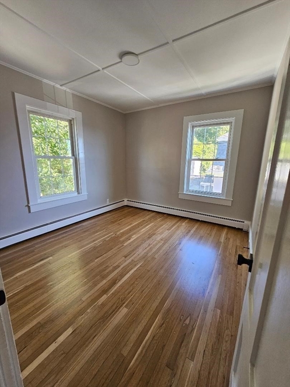 23 Ingalls Terrace, Unit 2 Swampscott, MA 01907 - Photo 9 of 24 a view of an empty room with wooden floor and a window