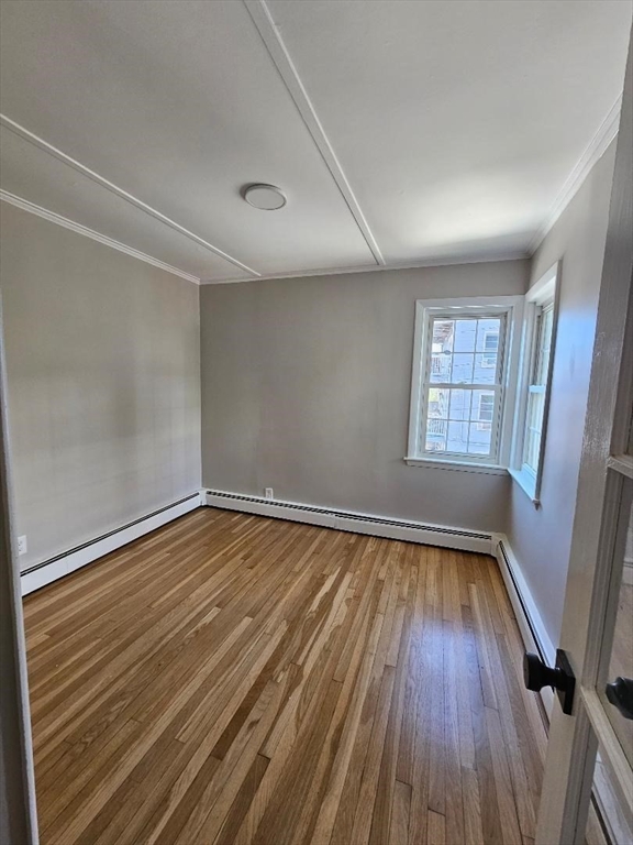 23 Ingalls Terrace, Unit 2 Swampscott, MA 01907 - Photo 10 of 24 wooden floor in an empty room with a window