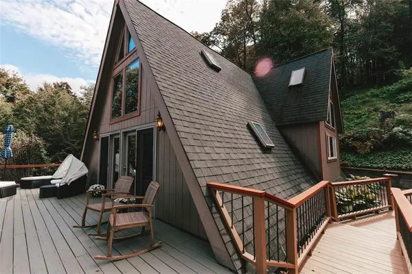 a bedroom with a large bed and a large window