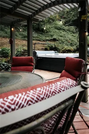 a view of a patio with wooden floor