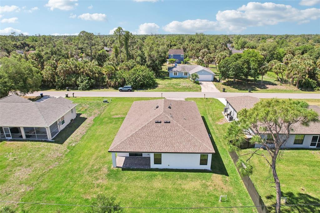 5237 Aberback Street North Port, FL 34291 - Photo 13 of 46 a aerial view of a house with swimming pool and a yard