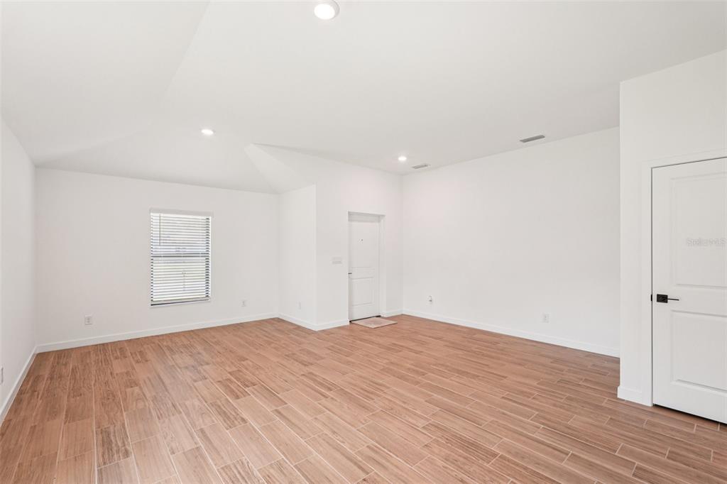 5237 Aberback Street North Port, FL 34291 - Photo 17 of 46 a view of empty room with wooden floor