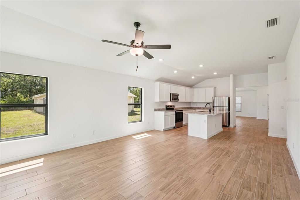 5237 Aberback Street North Port, FL 34291 - Photo 20 of 46 a view of kitchen with wooden floor and window