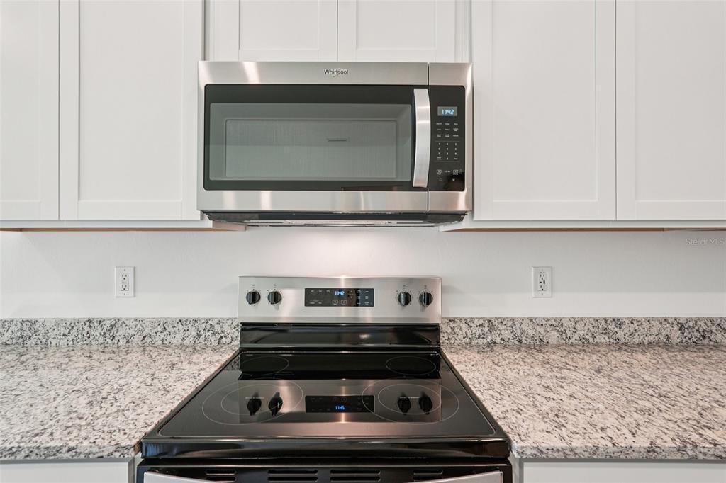 5237 Aberback Street North Port, FL 34291 - Photo 23 of 46 a stove top oven sitting inside of a kitchen