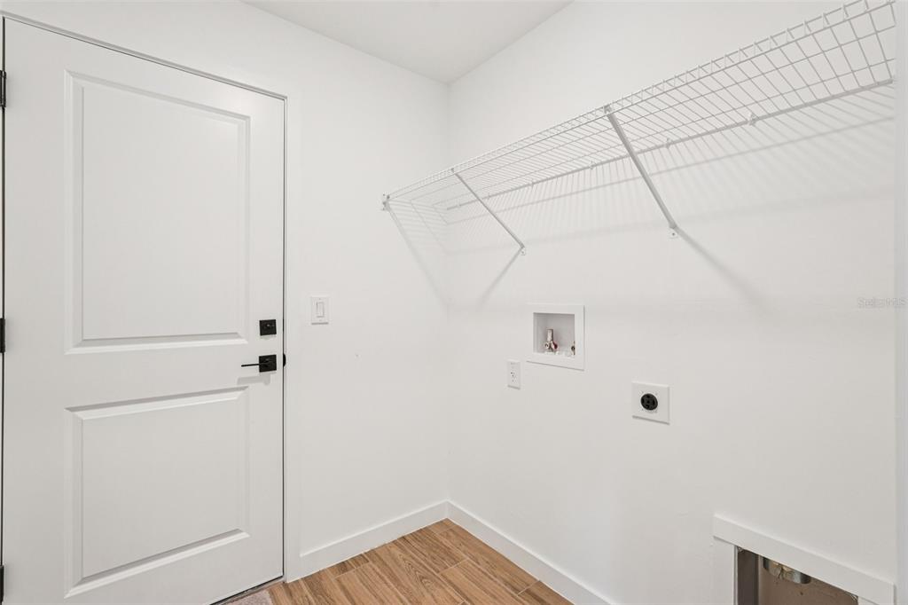 5237 Aberback Street North Port, FL 34291 - Photo 25 of 46 a view of a room with wooden floor