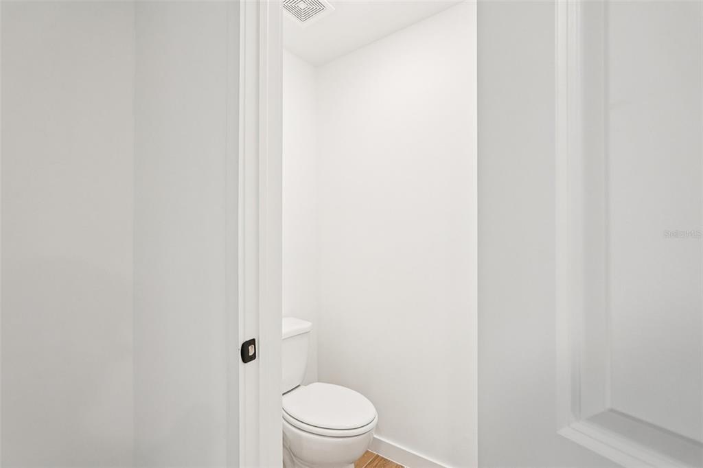5237 Aberback Street North Port, FL 34291 - Photo 27 of 46 a white toilet sitting next to a shower