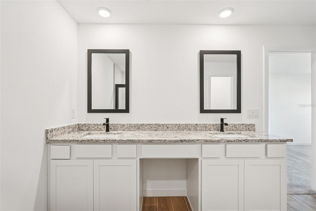 5237 Aberback Street North Port, FL 34291 - Photo 29 of 46 a bathroom with a granite countertop sink and a mirror