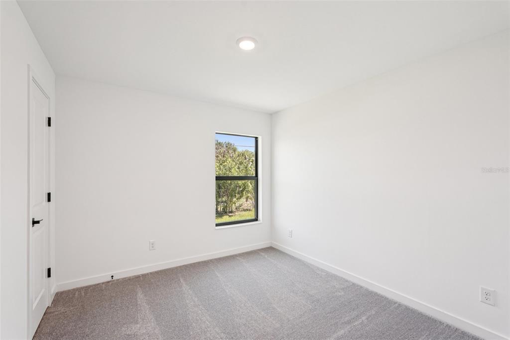 5237 Aberback Street North Port, FL 34291 - Photo 39 of 46 an empty room with a window