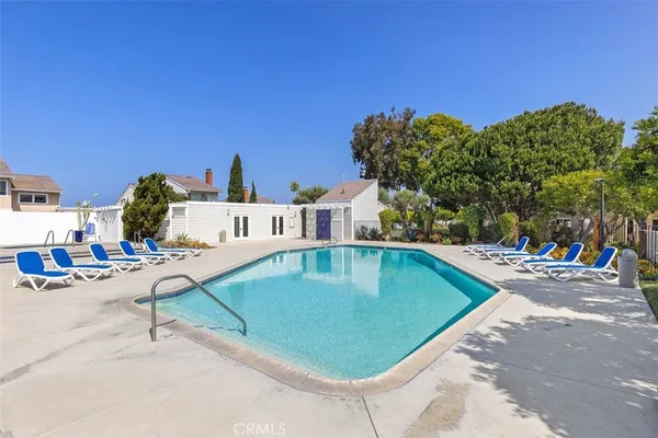 a view of a swimming pool with chairs