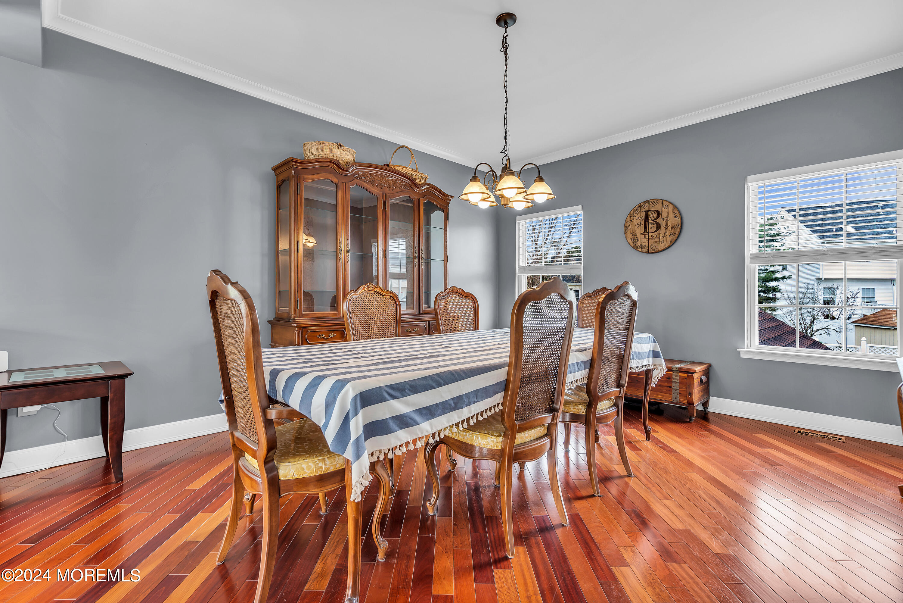 17 Gristmill Road Howell, NJ 07731 - Photo 12 of 71 a dining room with furniture a chandelier and wooden floor