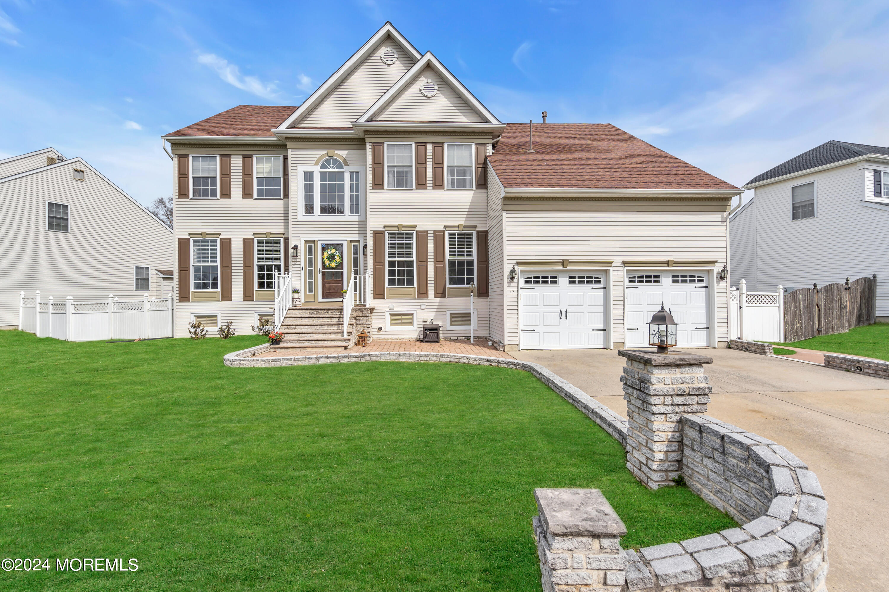 17 Gristmill Road Howell, NJ 07731 - Photo 2 of 71 a front view of a house with a yard table and chairs
