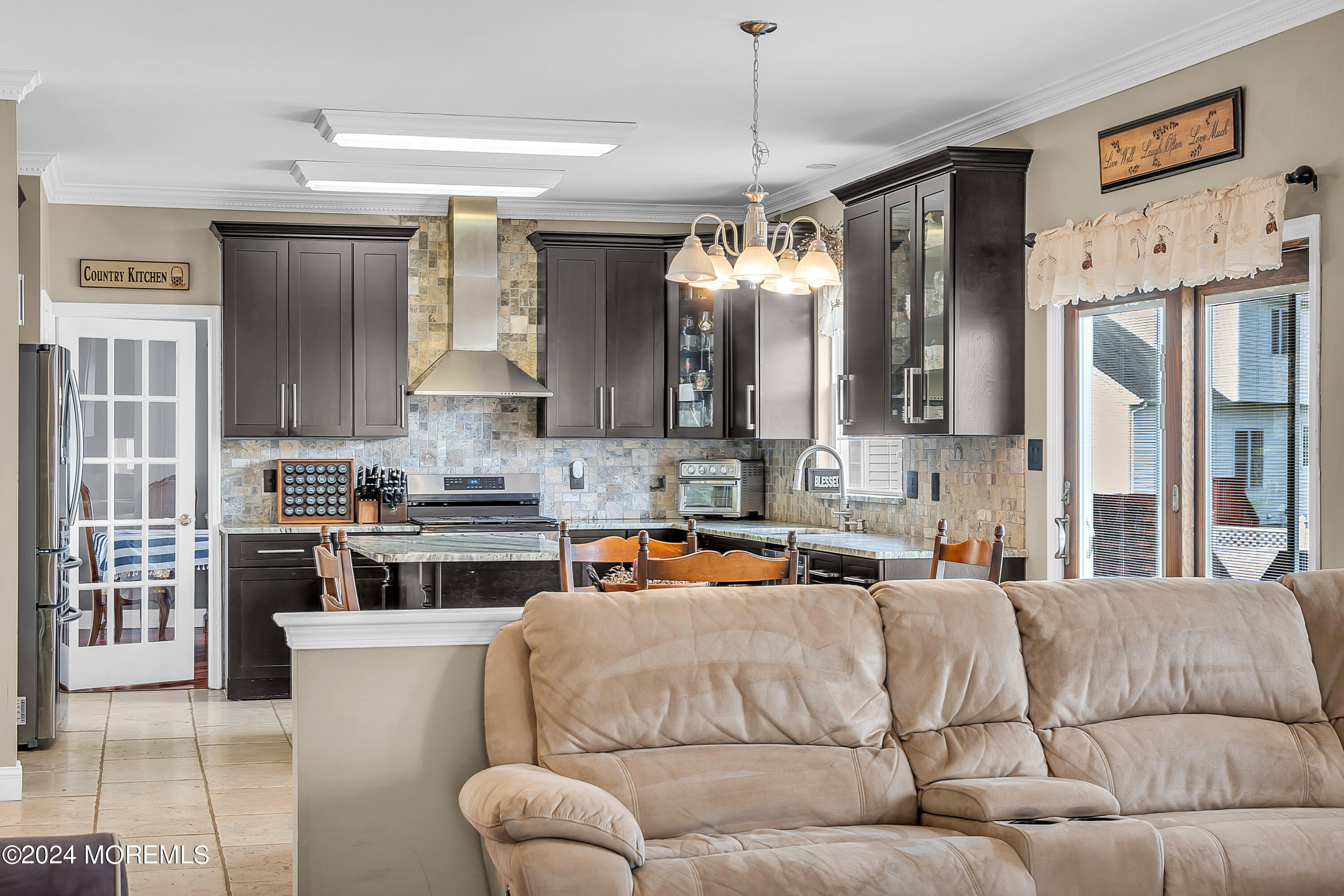 17 Gristmill Road Howell, NJ 07731 - Photo 23 of 71 a living room with stainless steel appliances kitchen island granite countertop furniture and a view of kitchen