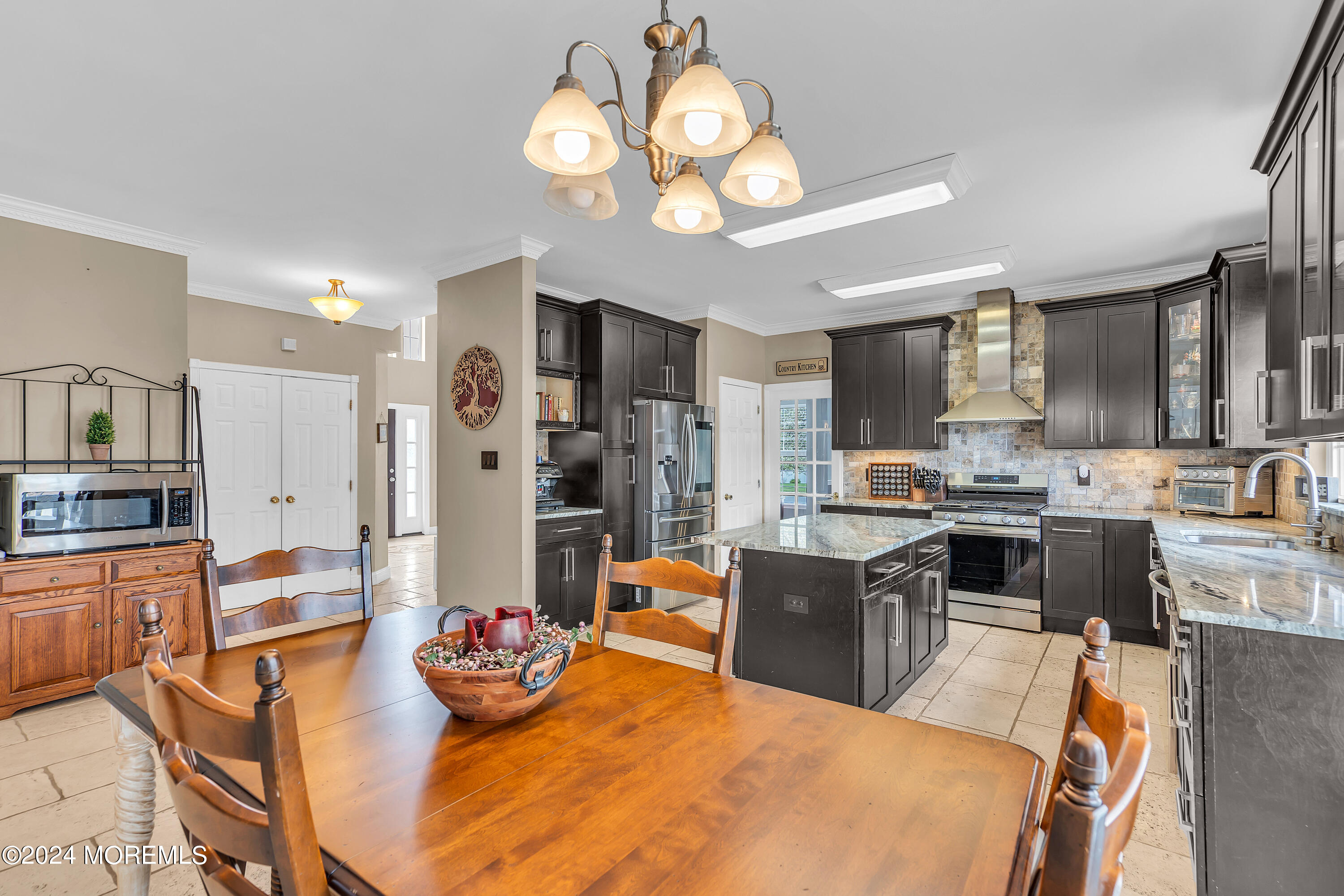 17 Gristmill Road Howell, NJ 07731 - Photo 26 of 71 a large kitchen with a table and chairs