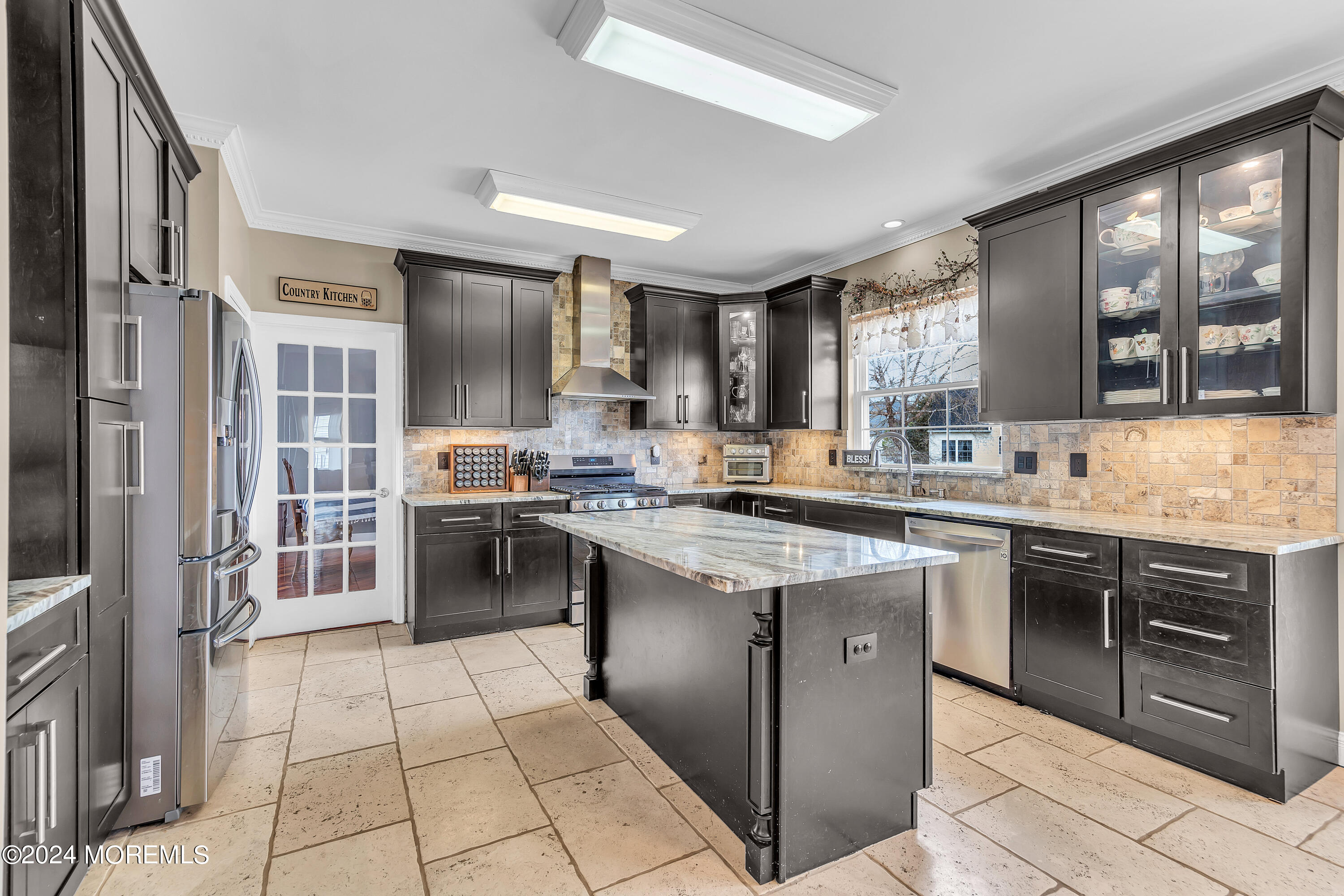 17 Gristmill Road Howell, NJ 07731 - Photo 30 of 71 a kitchen with stainless steel appliances granite countertop a stove and cabinets
