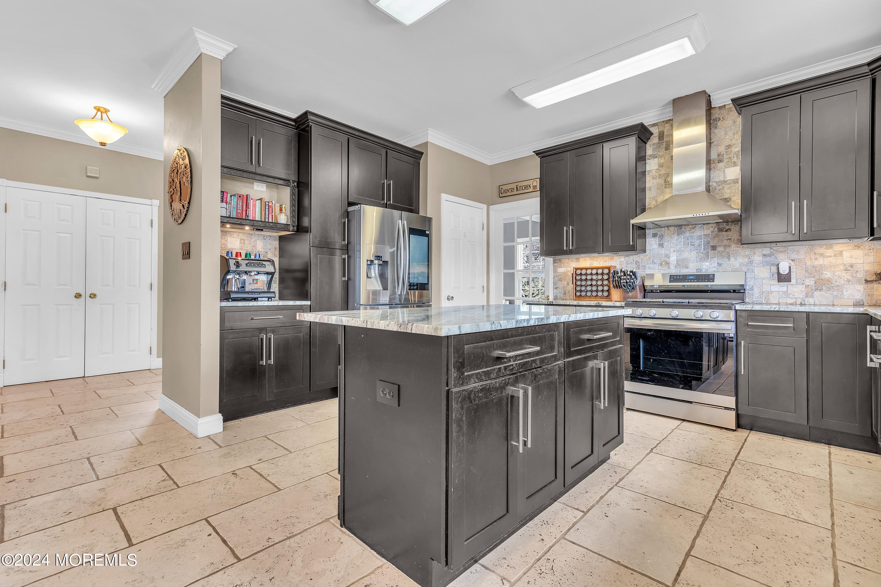 17 Gristmill Road Howell, NJ 07731 - Photo 31 of 71 a kitchen with stainless steel appliances granite countertop a stove a sink dishwasher and a refrigerator