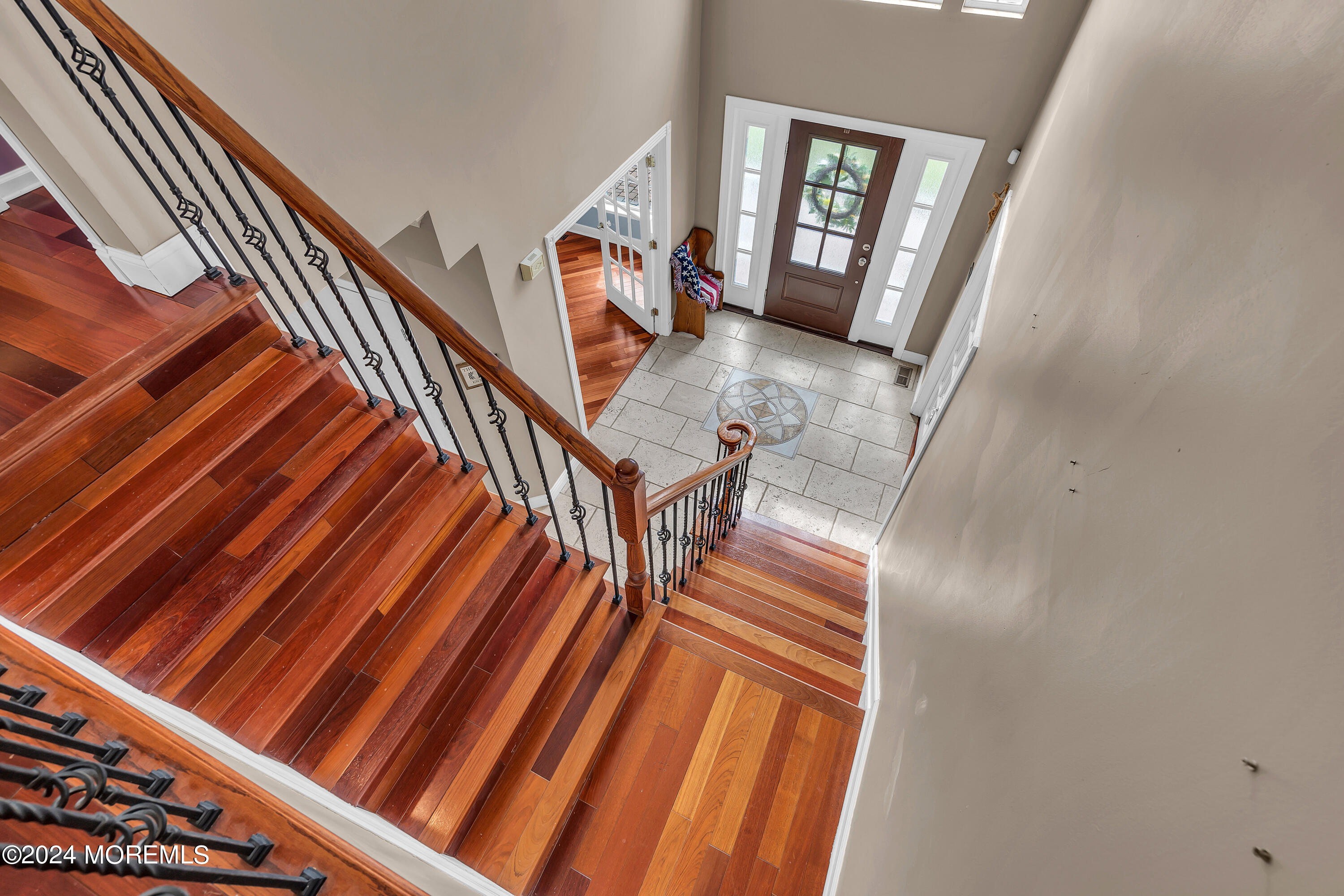 17 Gristmill Road Howell, NJ 07731 - Photo 39 of 71 a view of stairs and hall with wooden floor