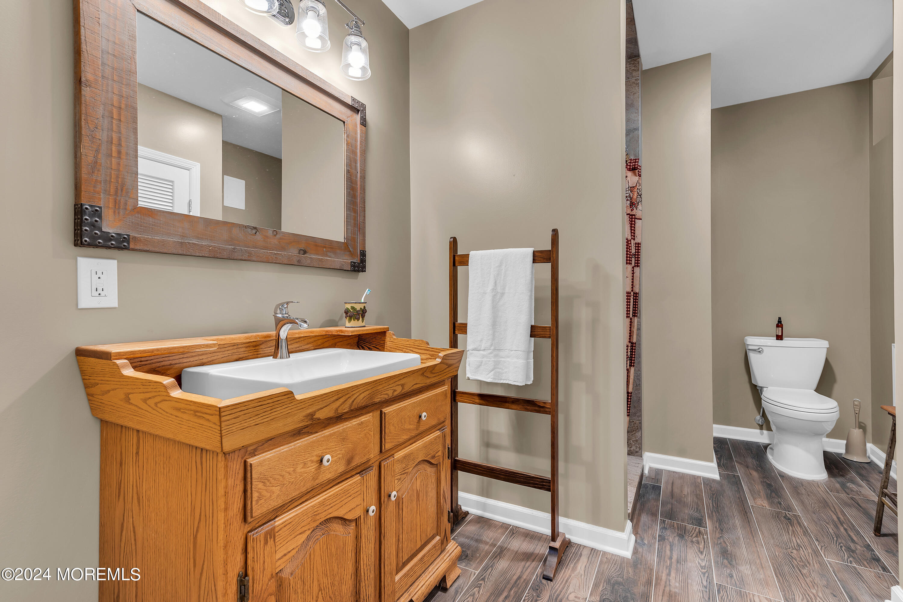 17 Gristmill Road Howell, NJ 07731 - Photo 59 of 71 a bathroom with a sink toilet and mirror