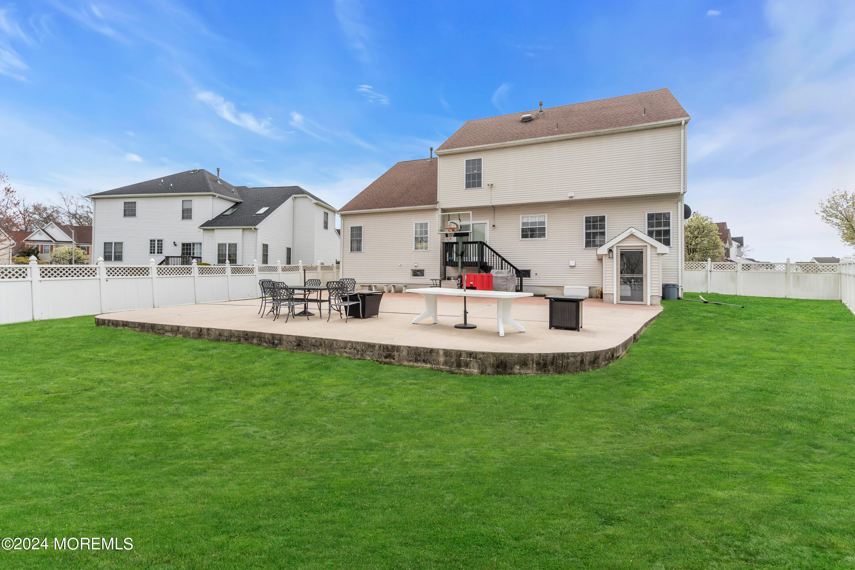 17 Gristmill Road Howell, NJ 07731 - Photo 62 of 71 a view of a house with a backyard and a patio