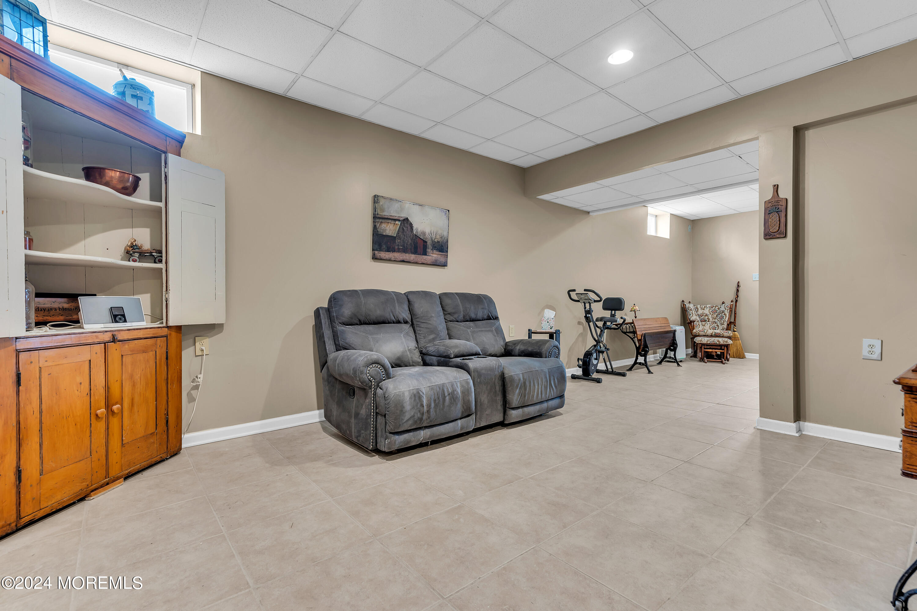 17 Gristmill Road Howell, NJ 07731 - Photo 65 of 71 a living room with furniture and a flat screen tv