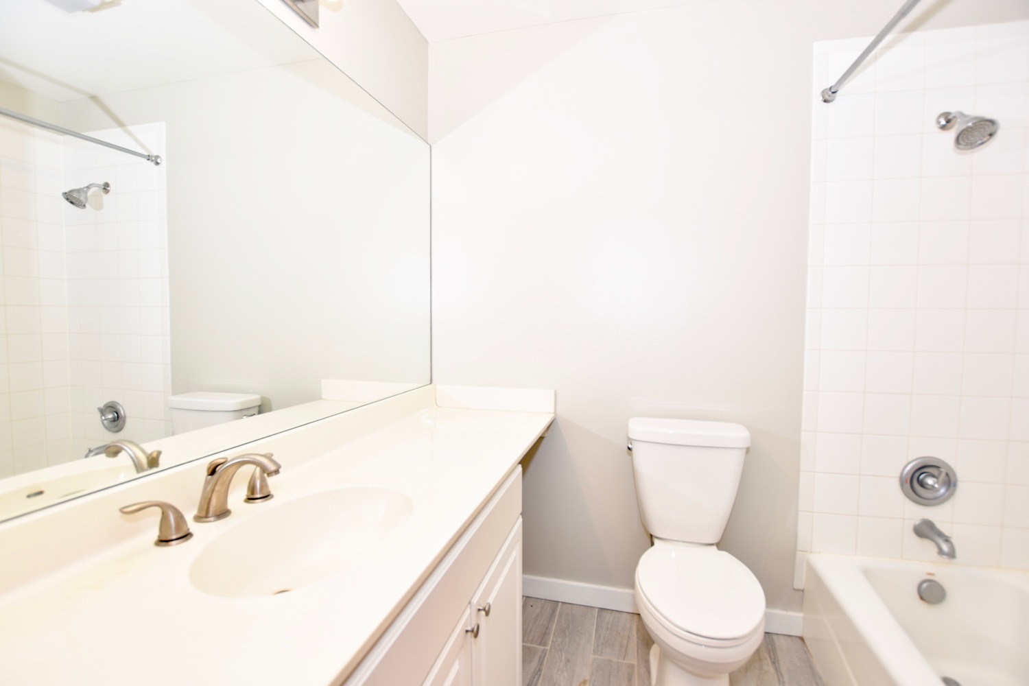 1801 West Diversey Parkway, Unit 18 Chicago, IL 60614 - Photo 11 of 32 a bathroom with a sink a toilet and shower curtain