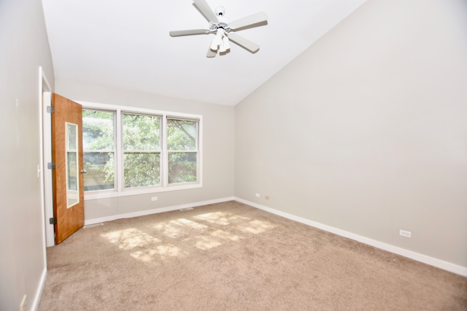 1801 West Diversey Parkway, Unit 18 Chicago, IL 60614 - Photo 19 of 32 an empty room with a window and a fan