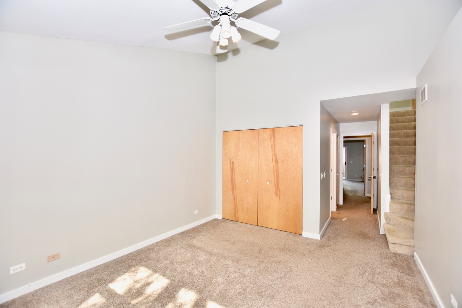 1801 West Diversey Parkway, Unit 18 Chicago, IL 60614 - Photo 22 of 32 an empty room with closet and a ceiling fan