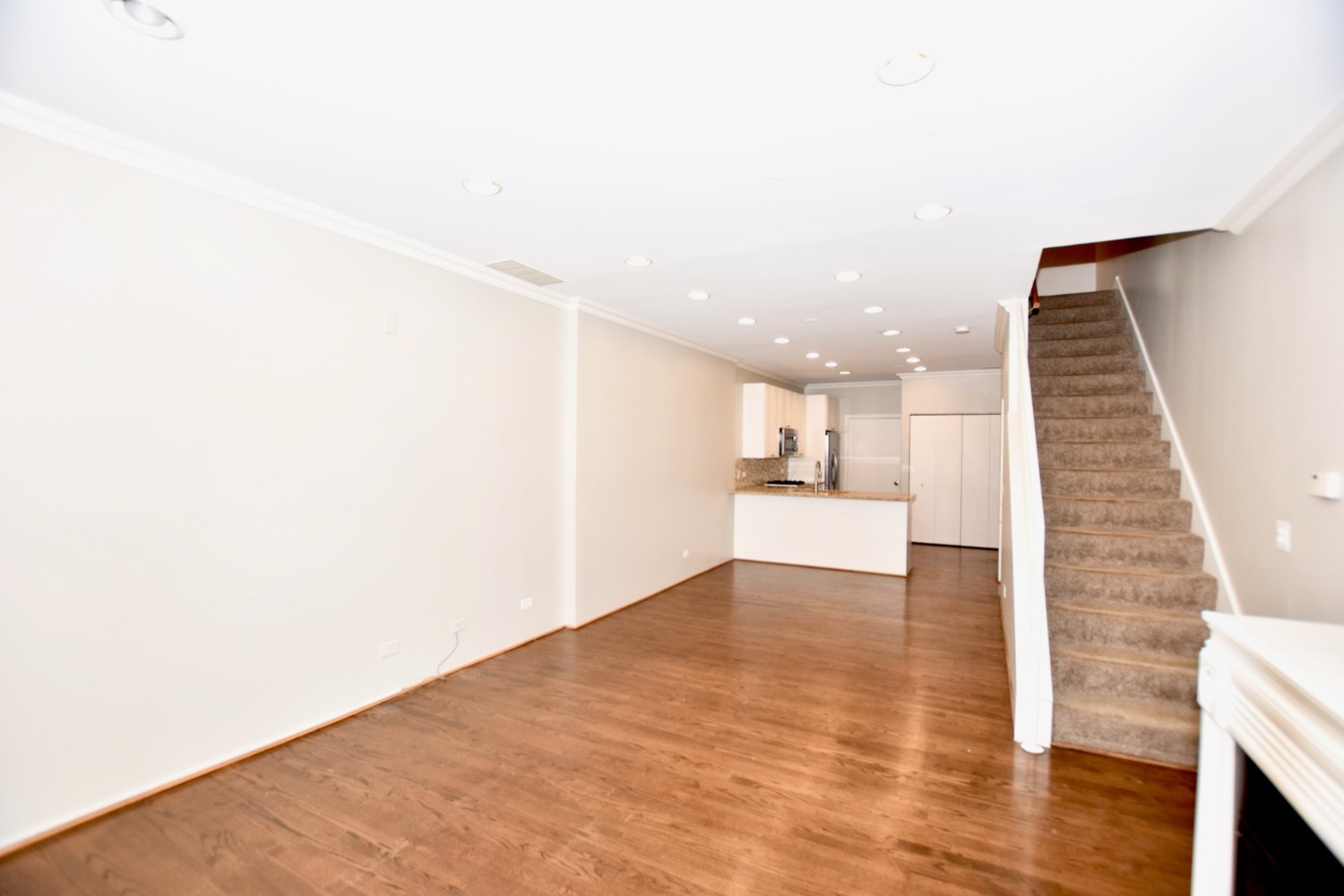 1801 West Diversey Parkway, Unit 18 Chicago, IL 60614 - Photo 6 of 32 a view of a kitchen with wooden floor