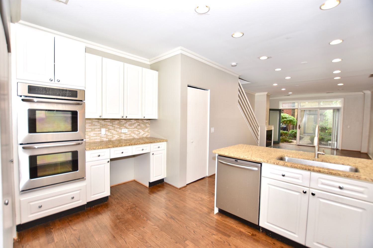 1801 West Diversey Parkway, Unit 18 Chicago, IL 60614 - Photo 8 of 32 a kitchen with a sink stove and microwave