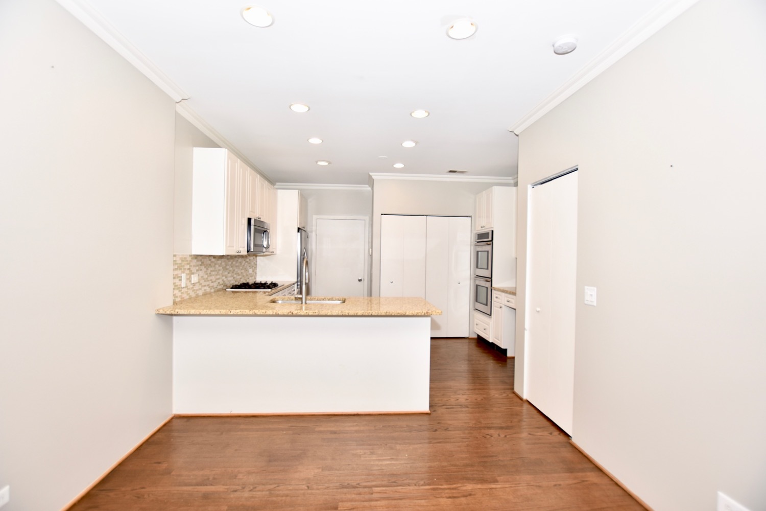 1801 West Diversey Parkway, Unit 18 Chicago, IL 60614 - Photo 10 of 32 a view of kitchen with kitchen island stainless steel appliances a sink and cabinets