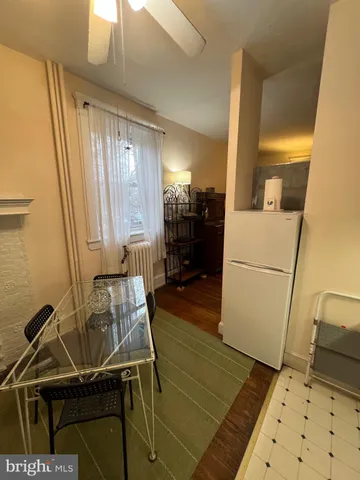 a kitchen with a table chairs stove and cabinets