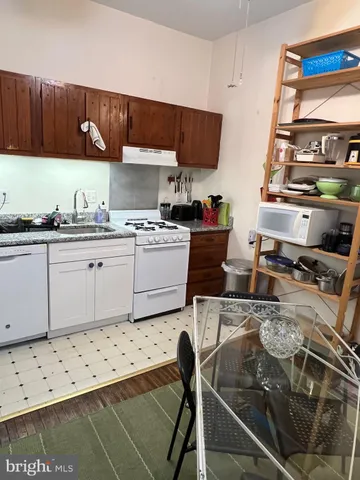 a kitchen with a stove and a sink