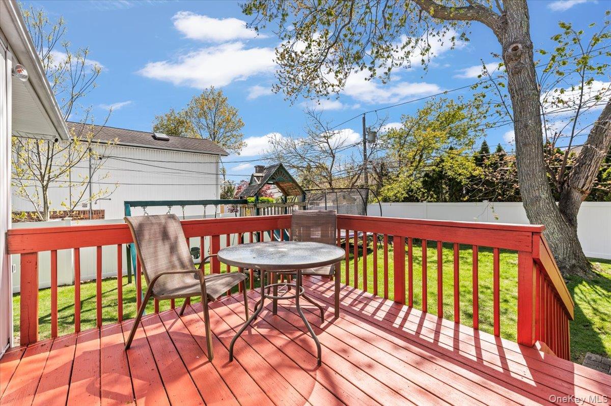 61 Winthrop Road Plainview, NY 11803 - Photo 28 of 37 a view of a chairs and table on the wooden floor
