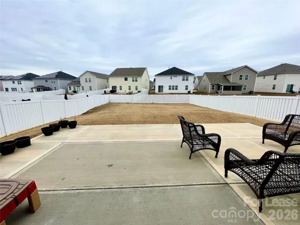 a view of living room kitchen with furniture and rug