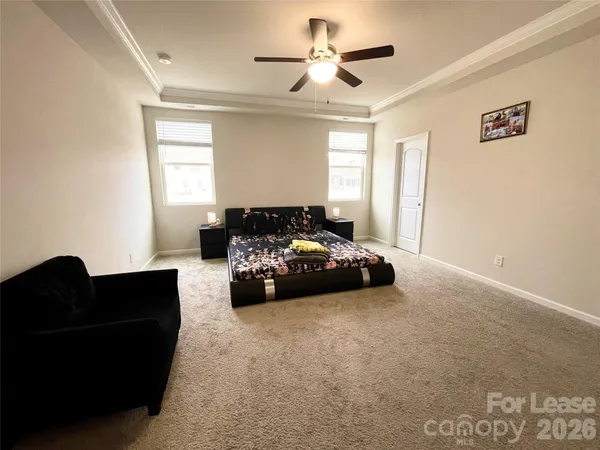 a bedroom with furniture and a window