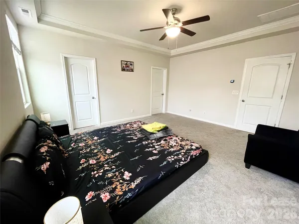 a bedroom with bed and window