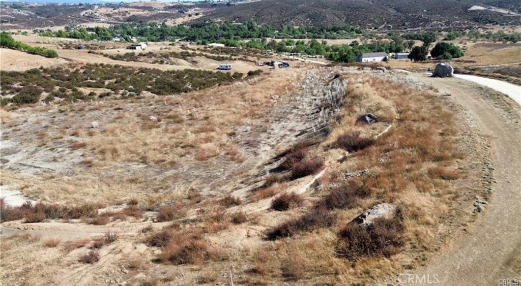 37500 Spring Valley Road Temecula, CA 92592 - Photo 1 of 1 a view of a dry yard with trees