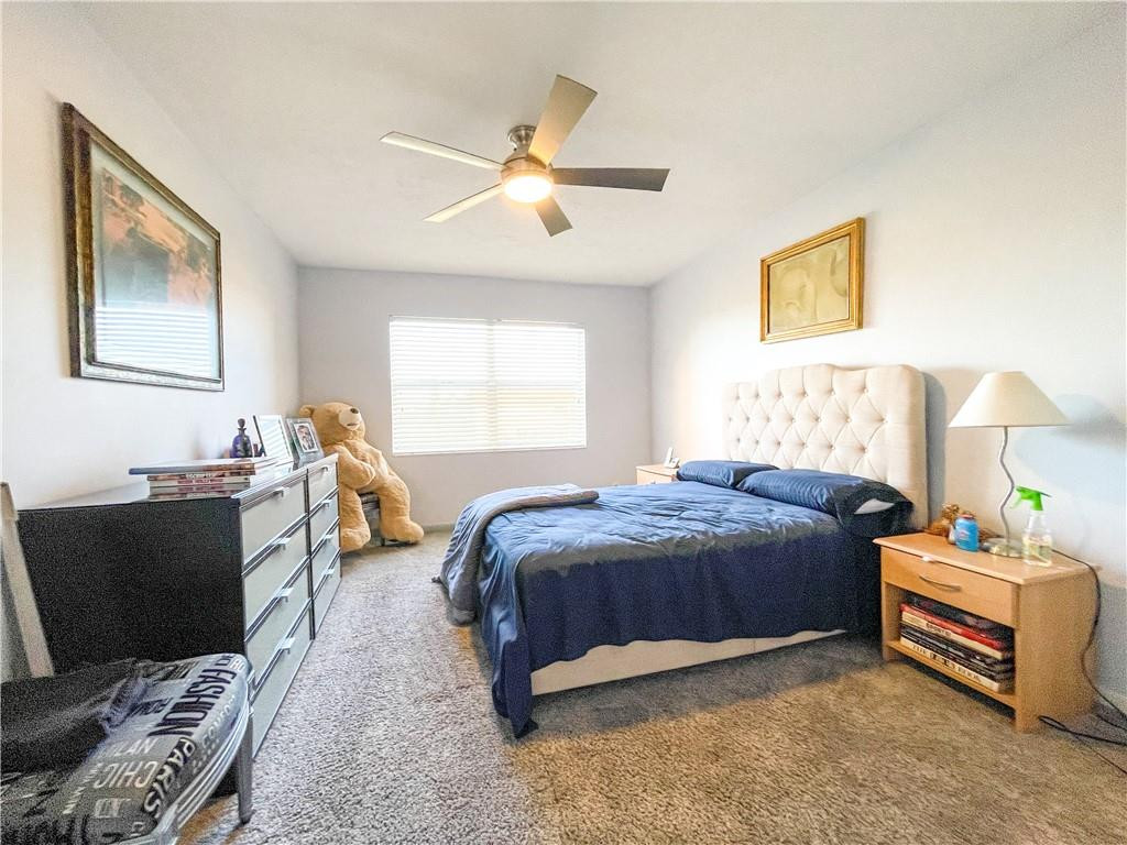 2781 North Pine Island Road, Unit 308 Sunrise, FL 33322 - Photo 13 of 16 a bedroom with a bed and a window