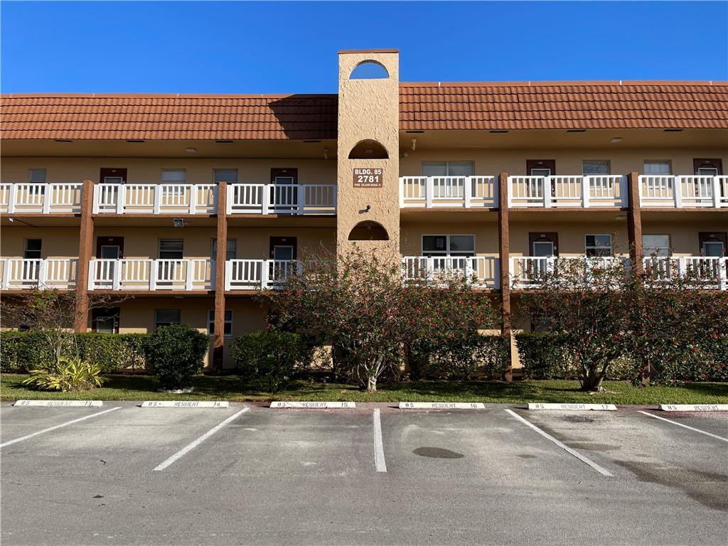 2781 North Pine Island Road, Unit 308 Sunrise, FL 33322 - Photo 2 of 16 a front view of a building